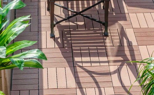Patio made with quick, interlocking composite deck tiles installation