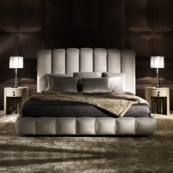 grey luxurious bed design with upholstered wood frame in a modern bed room with side table, table lamps and rug