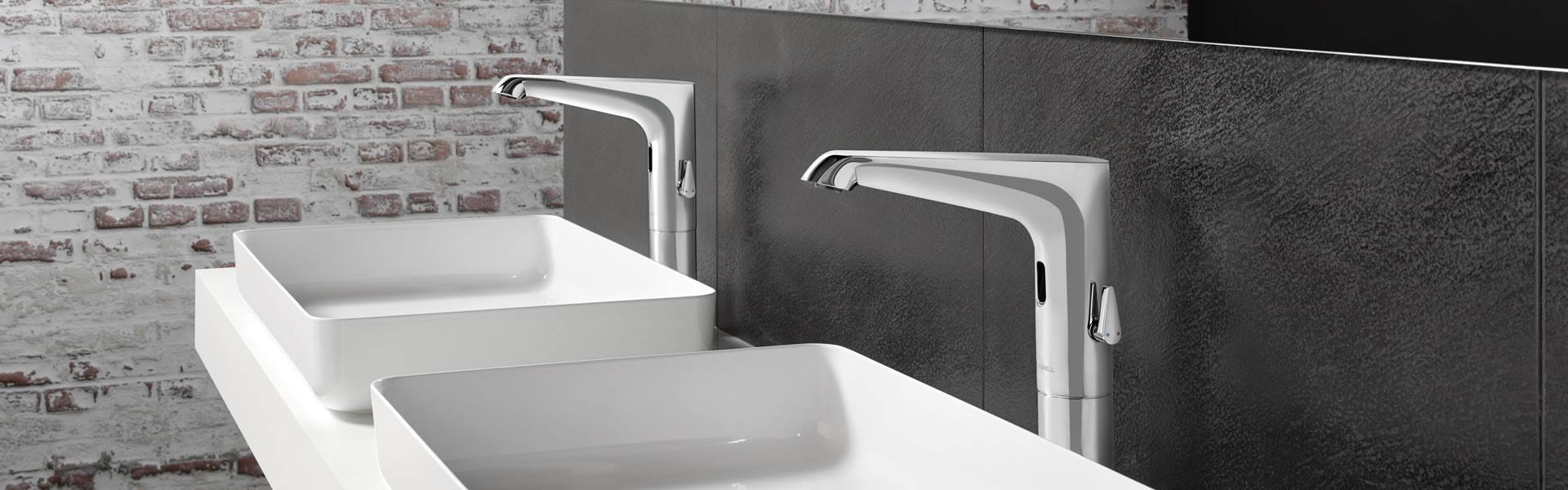 Xeris silver schell touchless tap in a washroom with white sink
