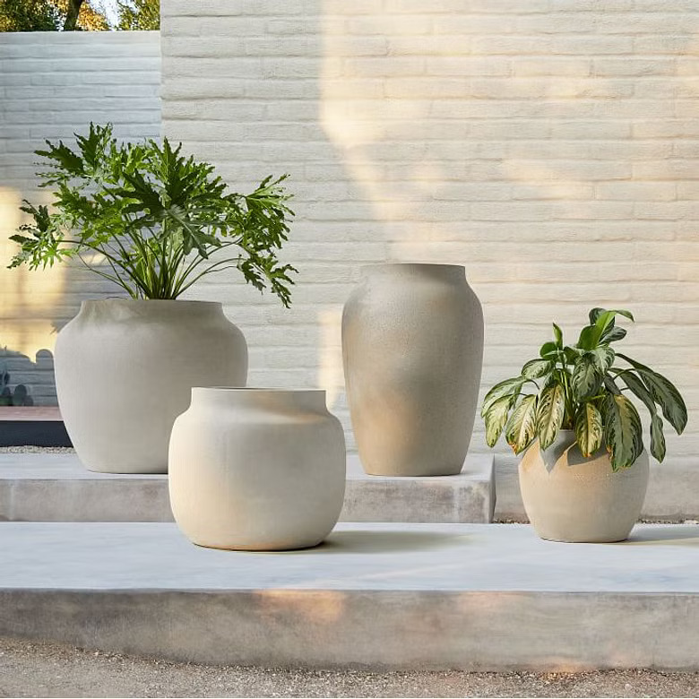 white planters with plants