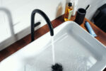Axor sleek basin mixer with continuous splash of water