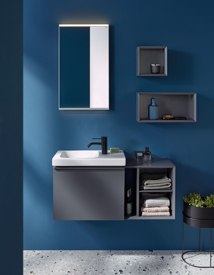blue bath design with grey cabinets mirror,black tap and shelves at ISH 2023