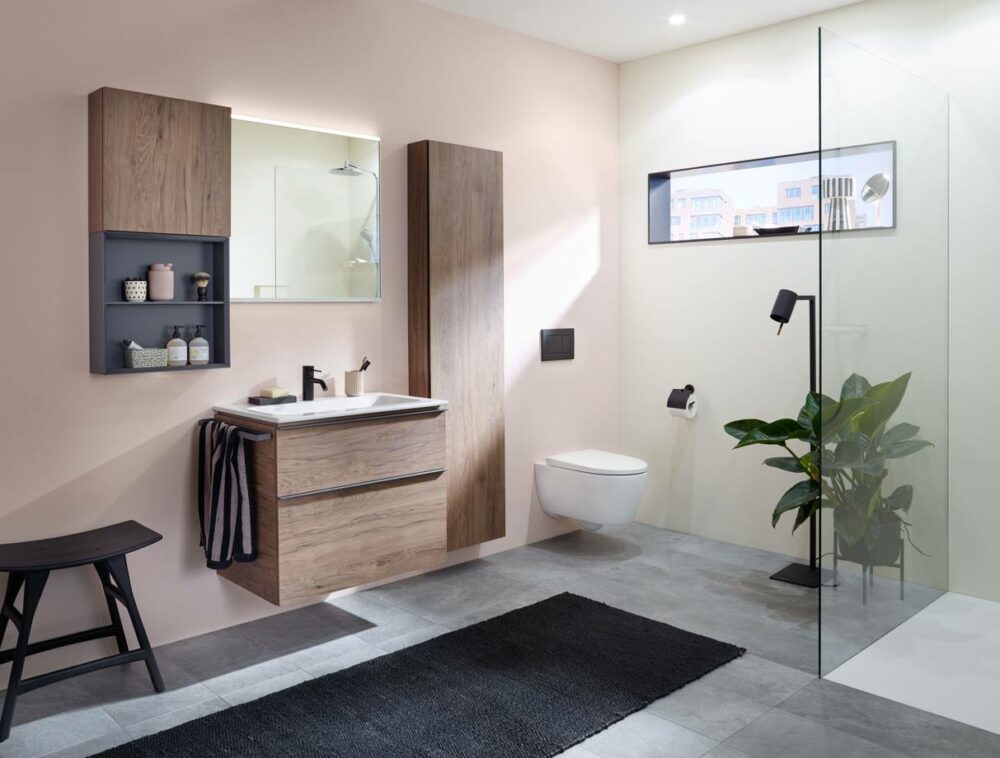 bathroom with brown cabinets. mirror, toilet, shower and carpet