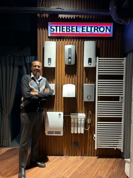 brown display wall at a showroom Mr. Pankaj Jain of Stylish Baths a bathroom fittings and sanitary ware dealer in Ludhiana of Stiebel Eltron