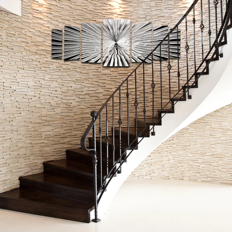 exquisite carved decorative niche, black stairs, white flooring, metal railing, classic design 