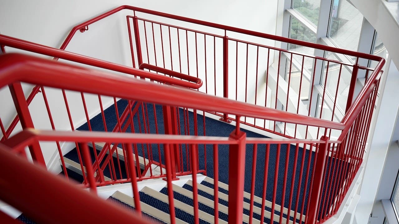 Stairs with red painted railings, modern small space stair design ideas