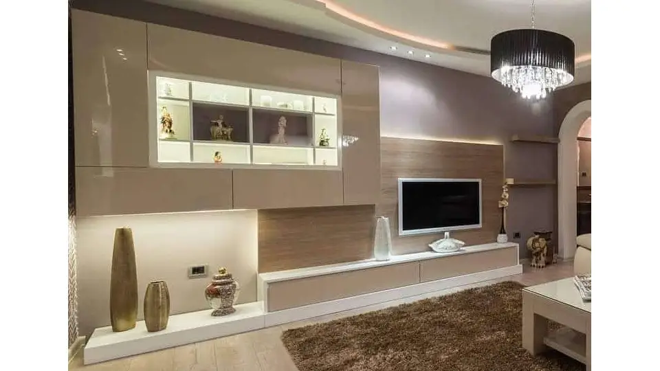 A royal look of living room with false ceiling and chandelier