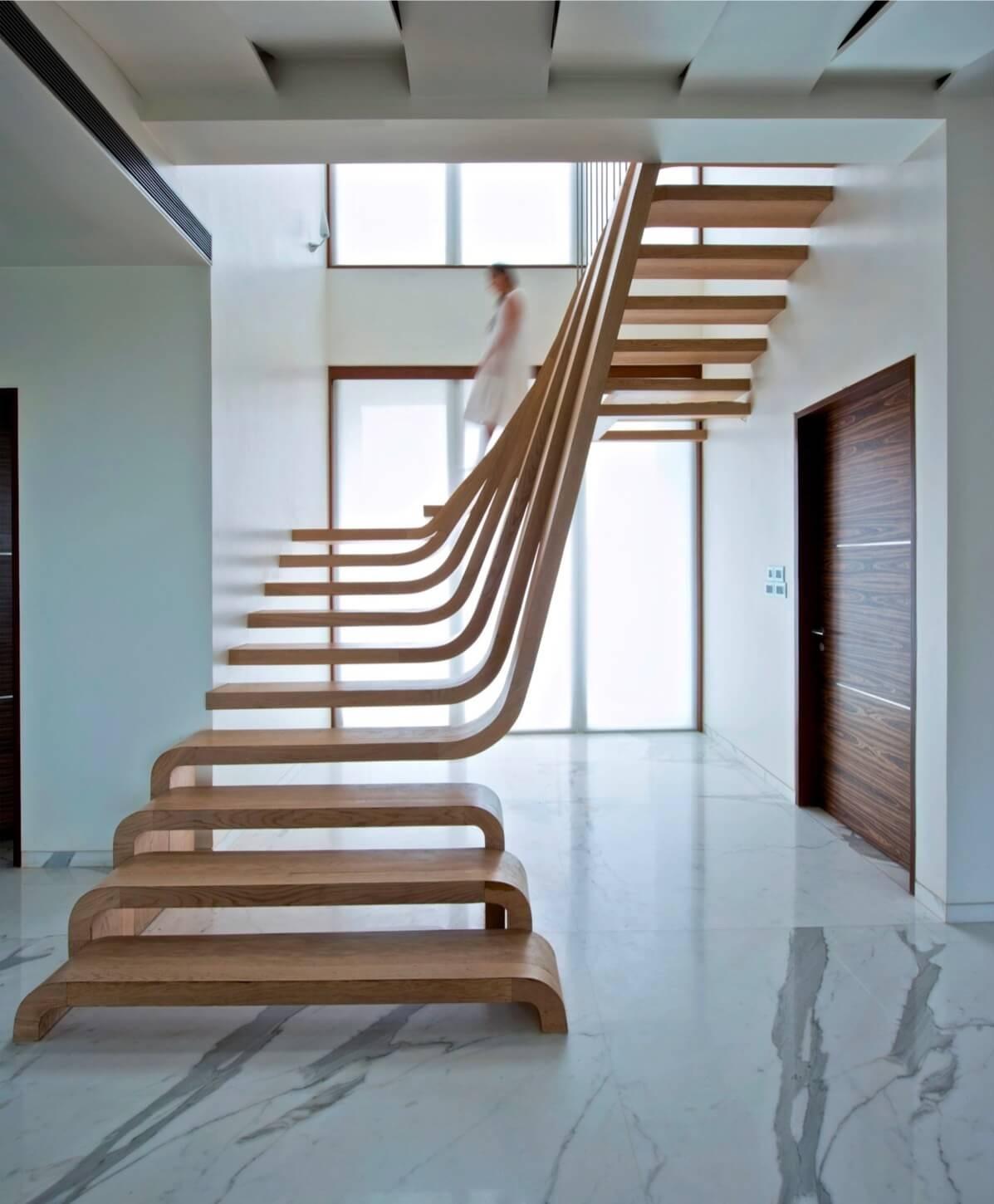 L-shaped stairs made of light brown hardwood, evenly spaced, small space staircase design