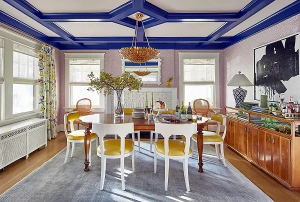 country-style dining room with vibrant blue and white coffered false ceiling