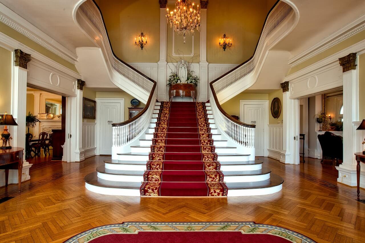 a luxurious stair with beautiful handrails and wooden balustrades