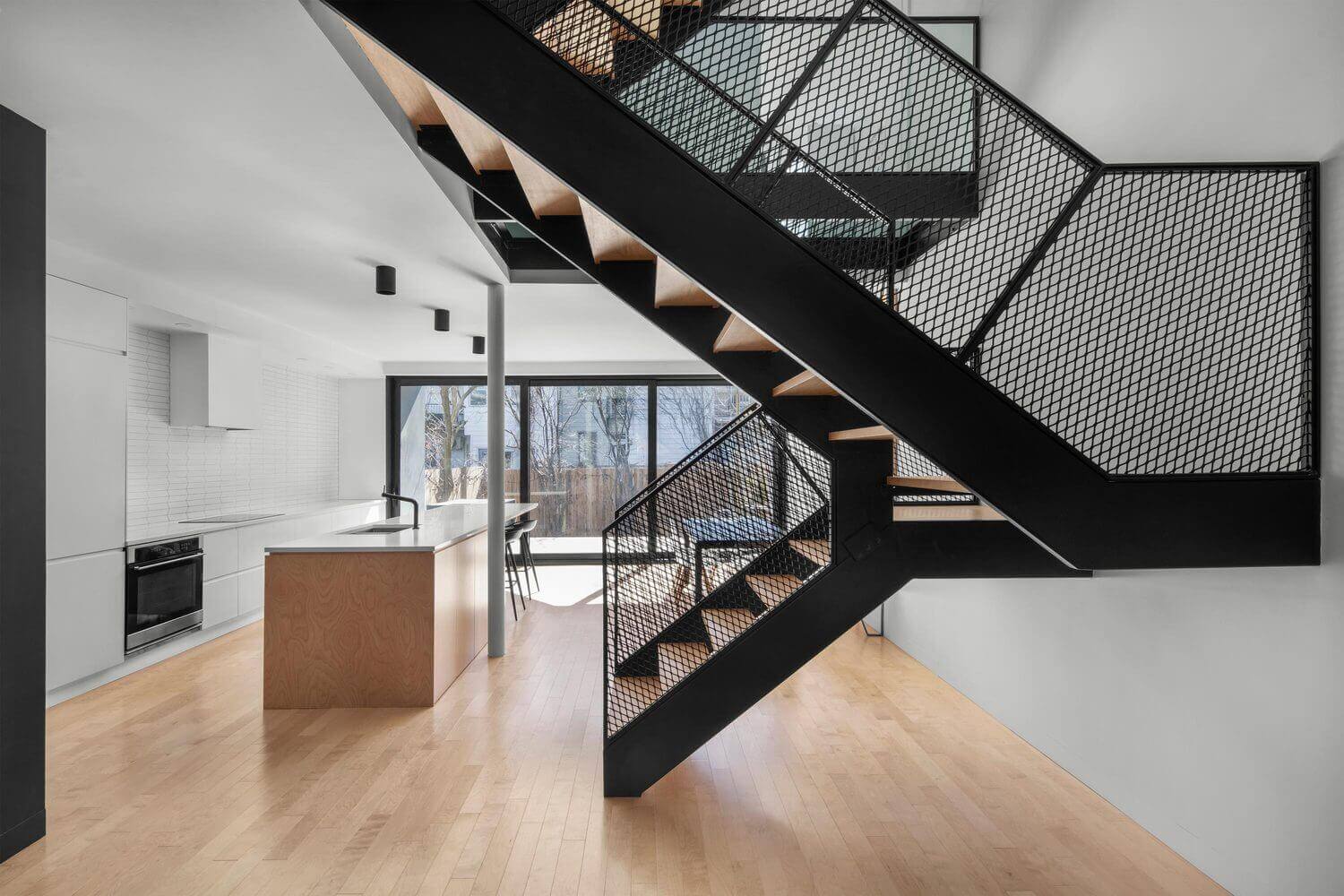 modern mesh railing staircase featuring sleek metal design and open mesh panels