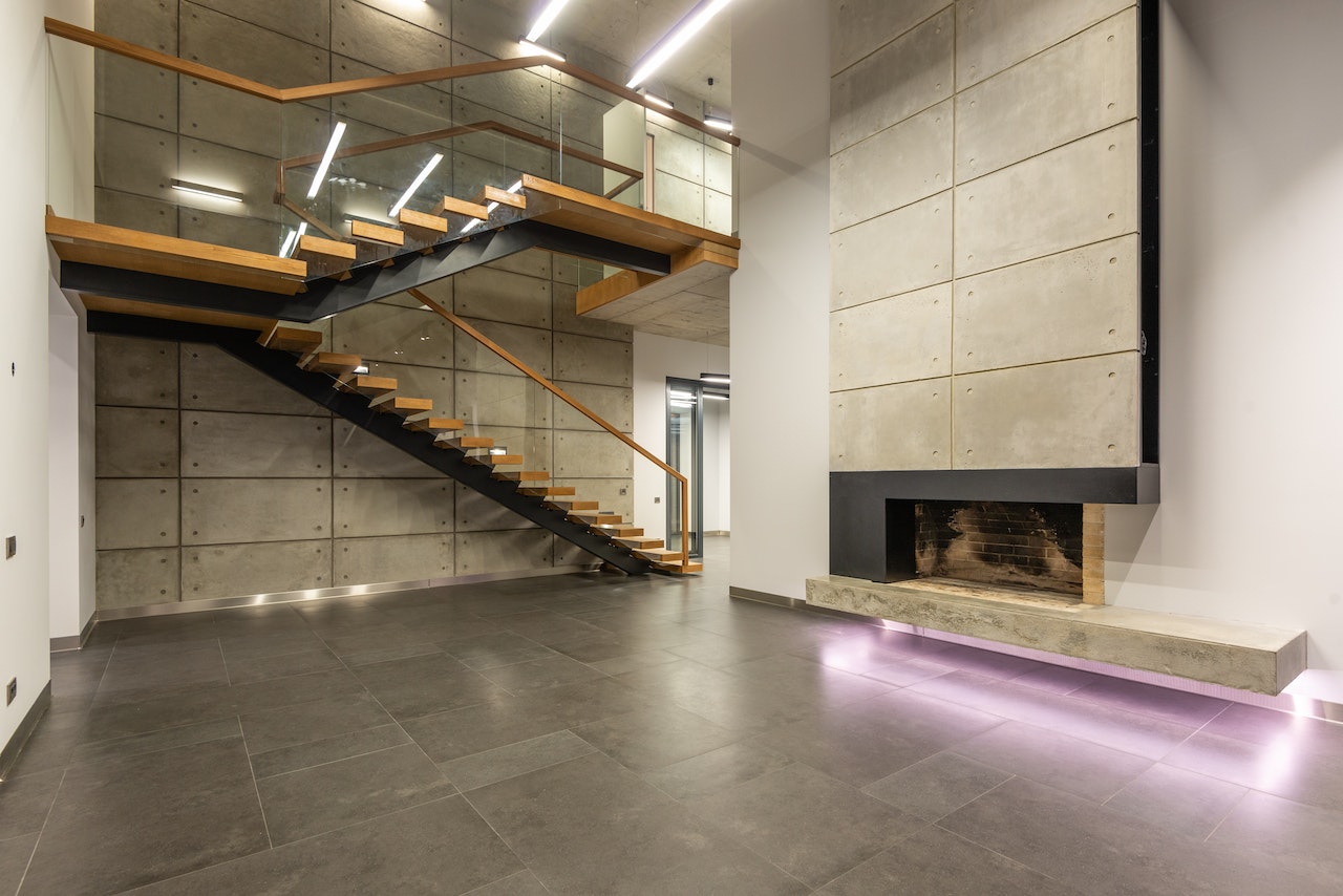 a sleek and modern glass and wood railing design stairs, showcasing a transparent glass panel with wooden frame