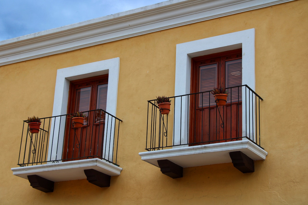 Black vertical railing with sleek design, providing safety and elegance to balcony