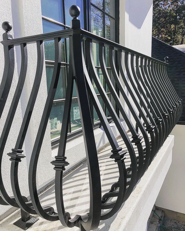 stylish zigzag-patterned railing adds a modern touch to balcony