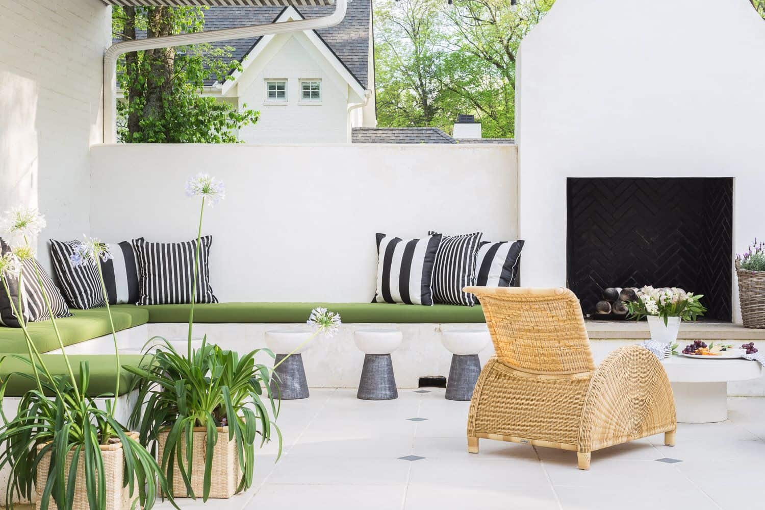 Outdoor seating with plants and chair with wall paint design idea
