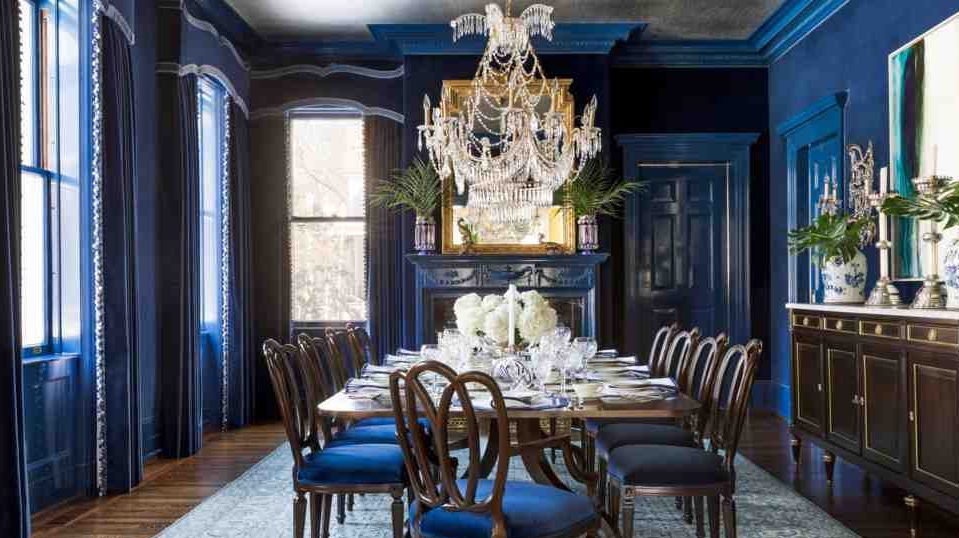 Large sapphire blue dining area with tables and chairs