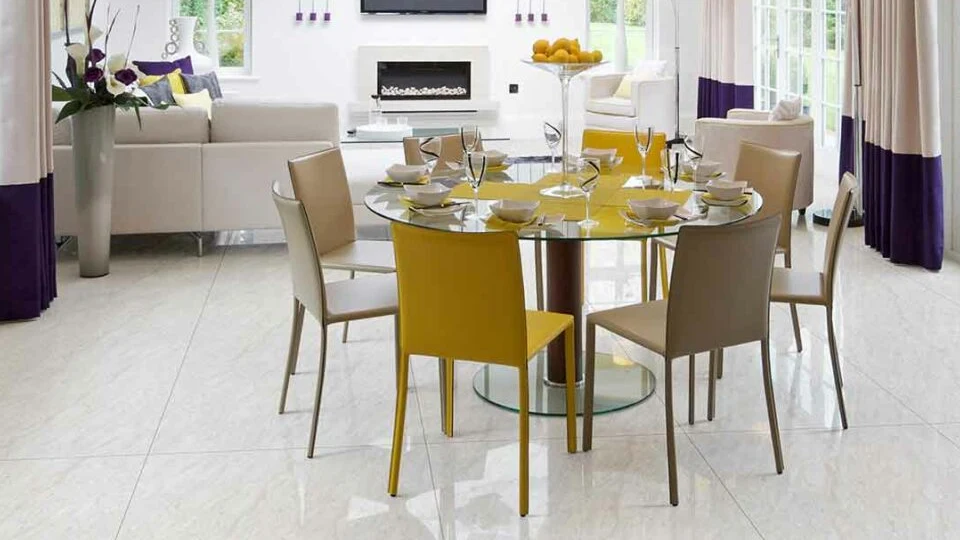 glossy vitrified flooring in a minimalist living cum dining room