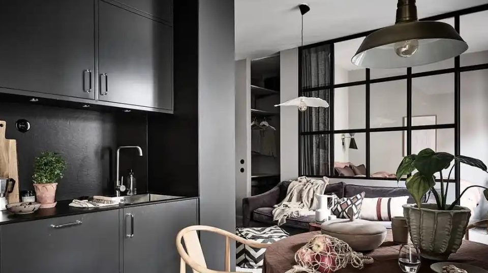 A combo of light and dark wall paint design idea studio apartment with table and chairs