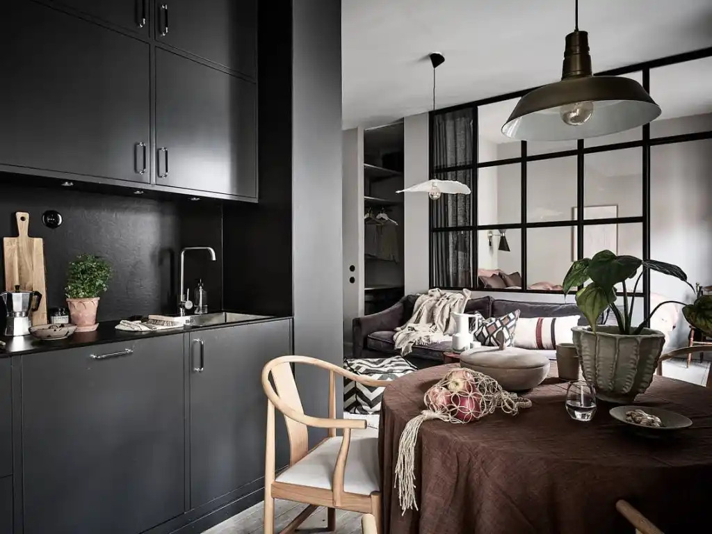 A combo of light and dark wall paint design idea studio apartment with table and chairs