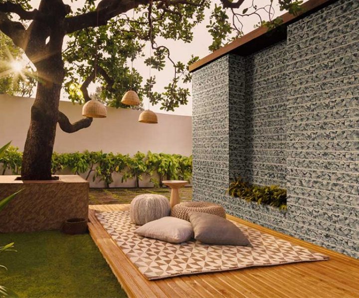Outdoor seating with patterned wall paint design idea and a tree 