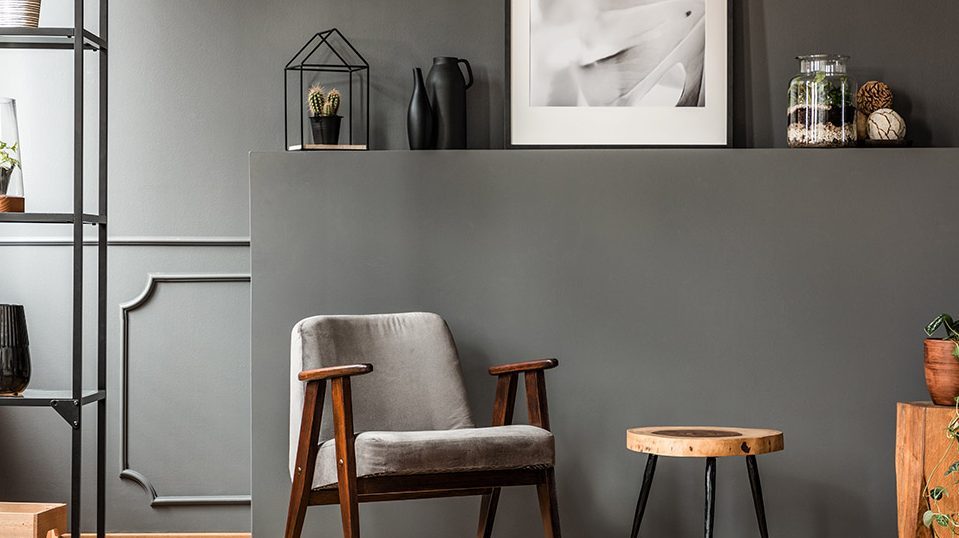 Grey wall finish with tables and other accessories