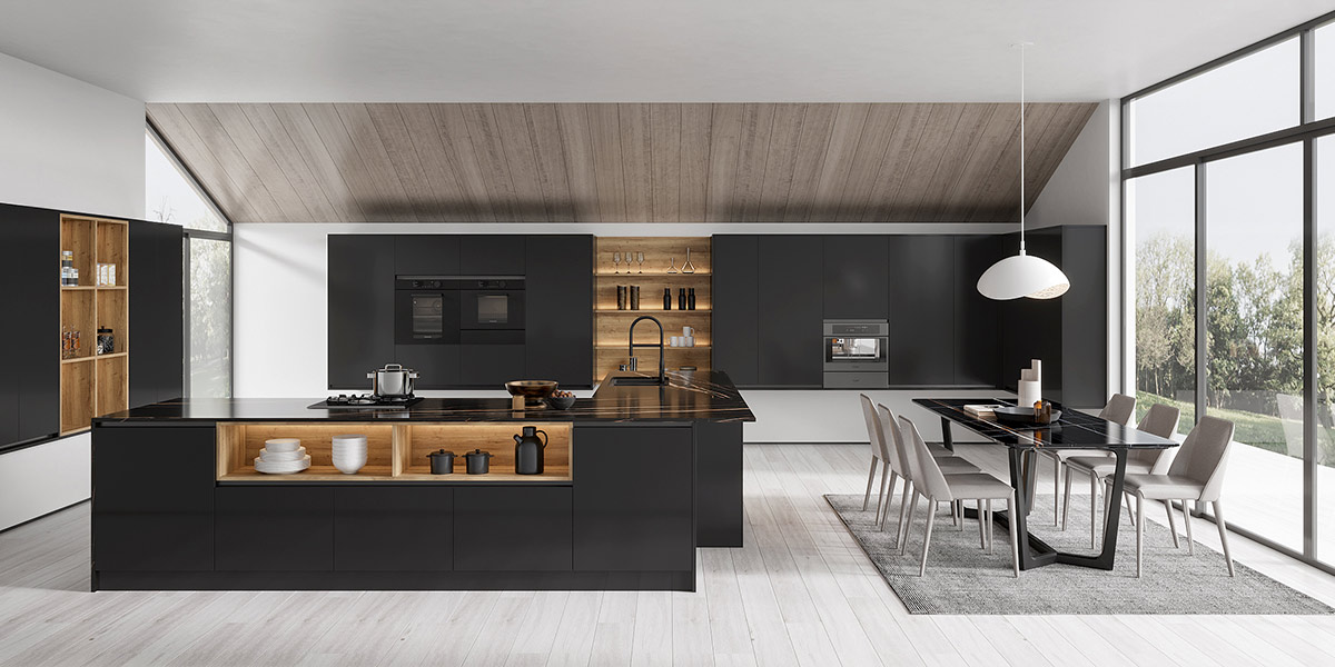black cabinets with a table, chairs, pendant light, appliances