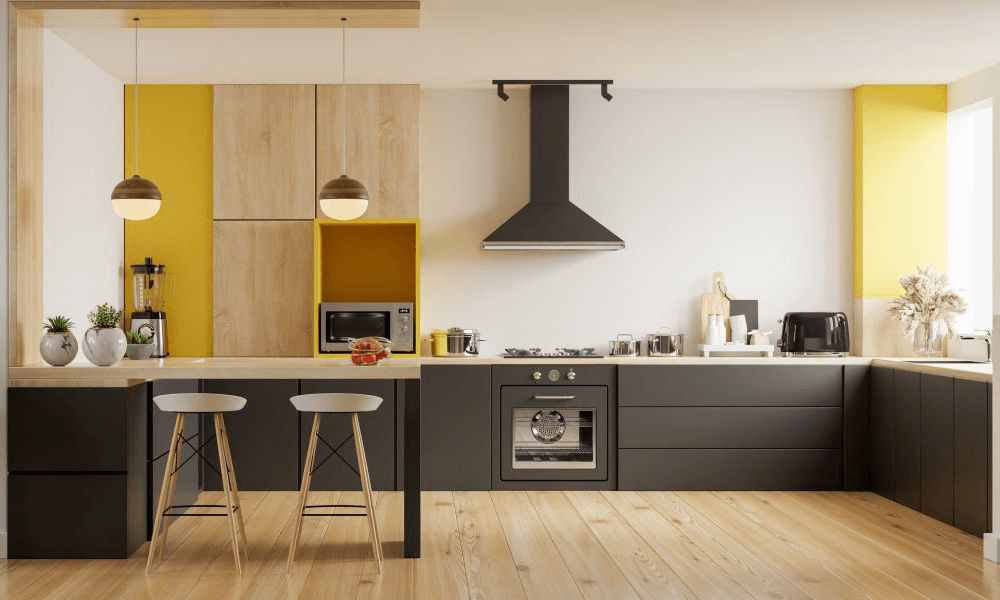 black kitchen with a chimney, kitchen island and brown wooden floors
