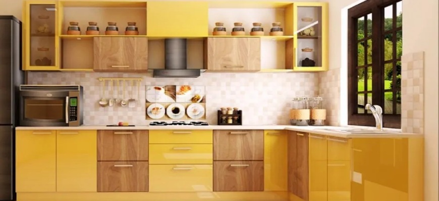yellow and brown kitchen cabinets & cupboards in a kitchen with modern appliances