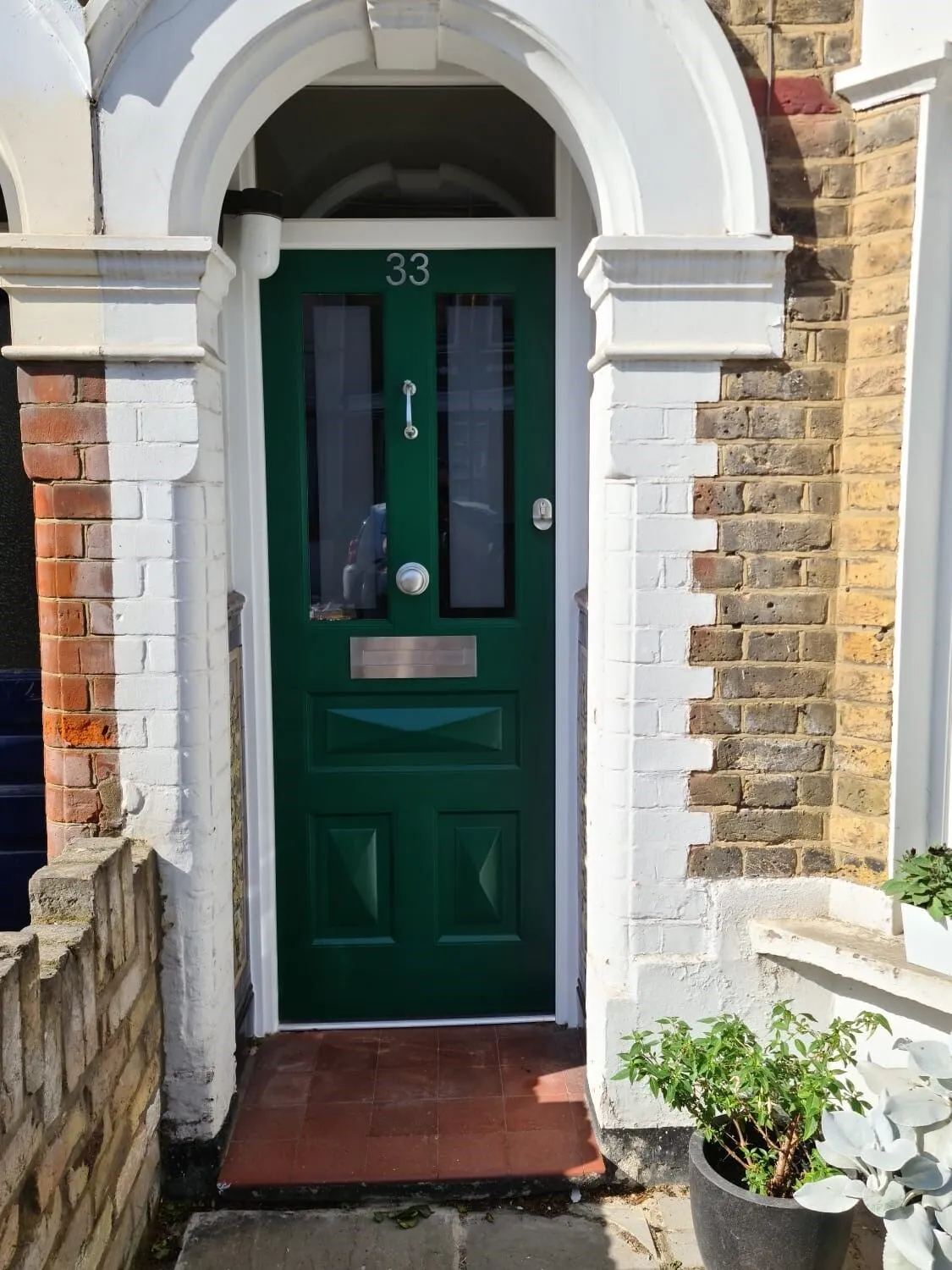 green Victorian wooden door design for a modern home
