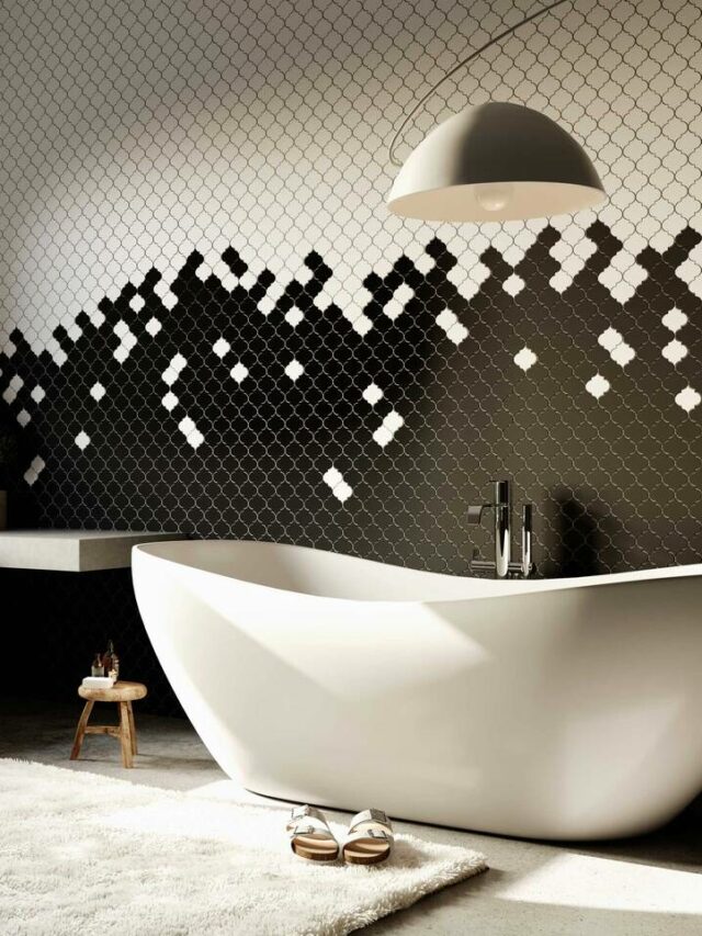 monochrome bathroom, mosaic tiles, bathtub, hanging light, window, rug