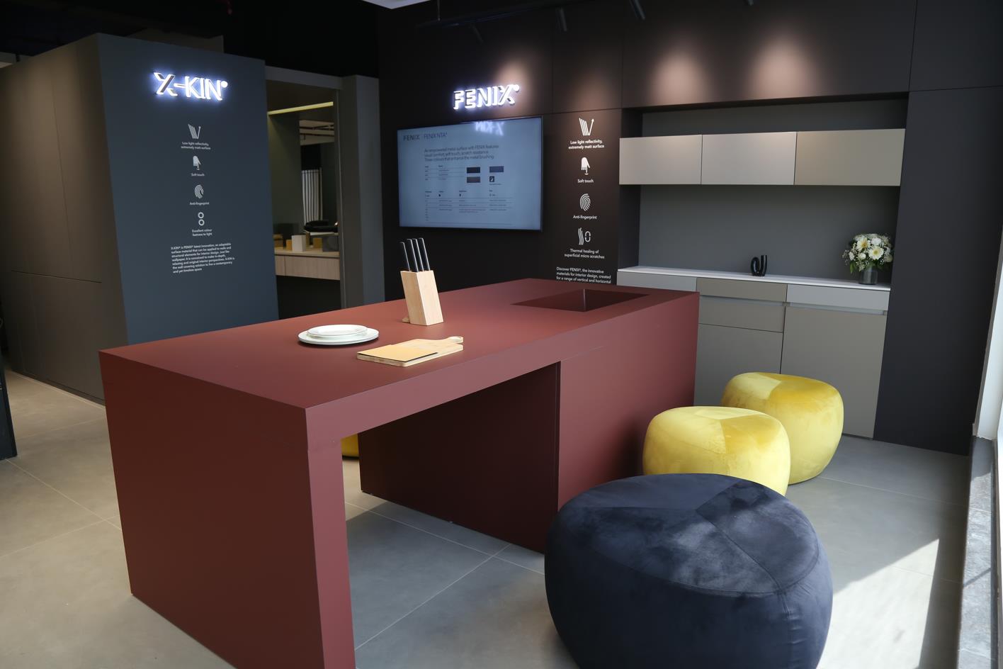 office space with maroon table, yellow and black seating