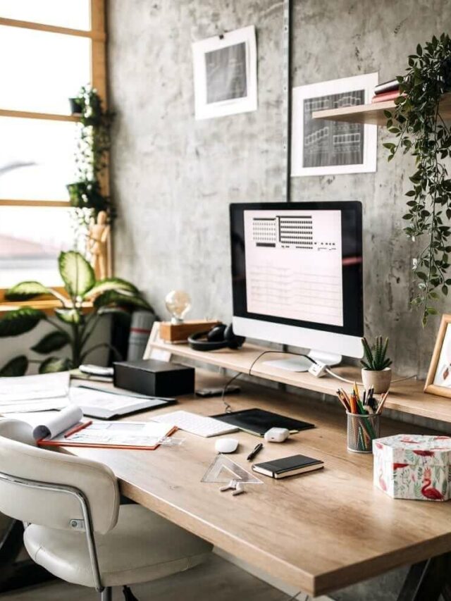 home office with brown desk and work station