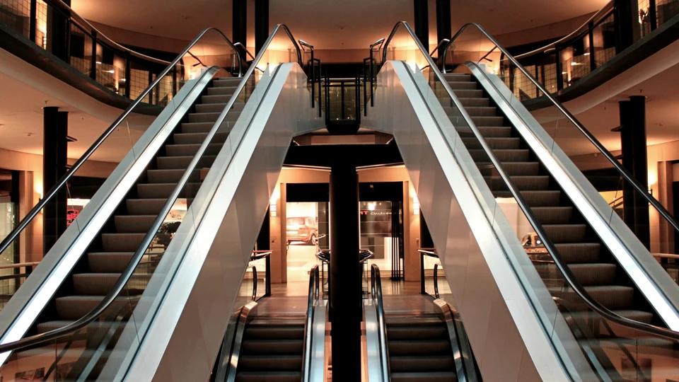 Stylish escalator design with glass handrails