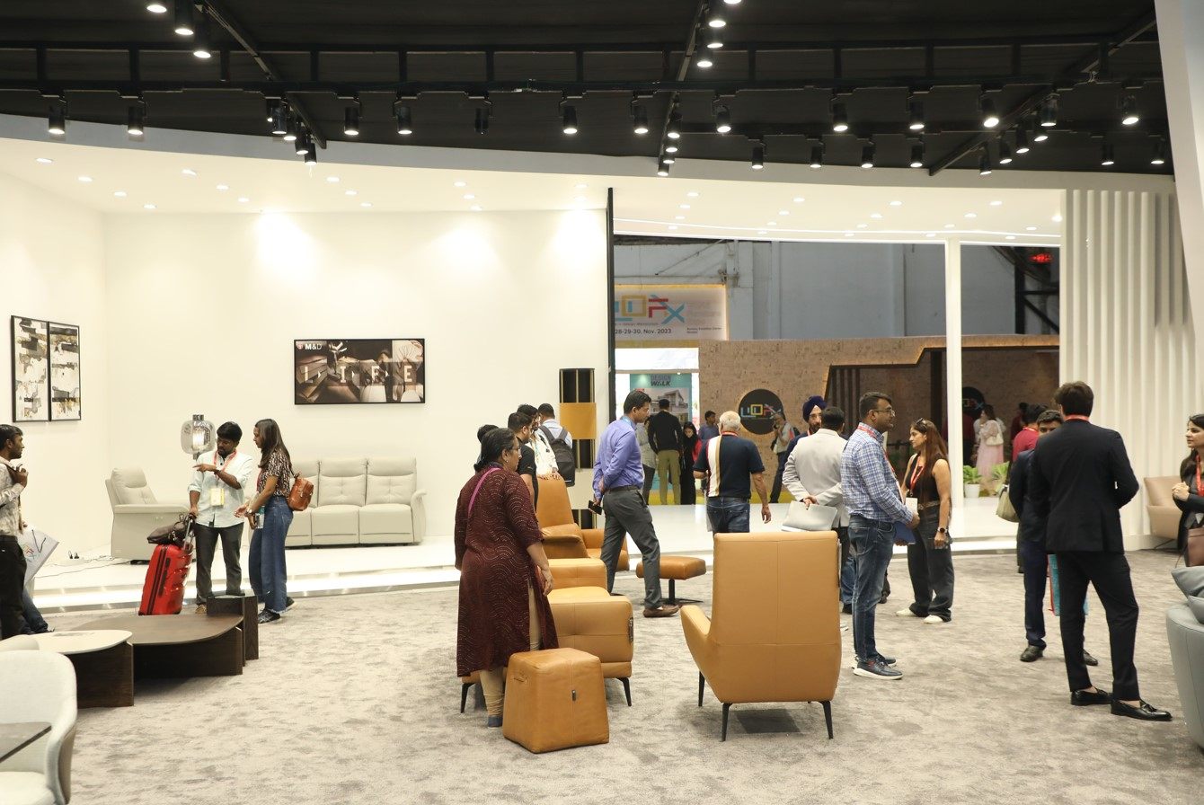 Crowd examining displays at WOFX - World Furniture Expo 2023 a leading event in the furniture and design industry