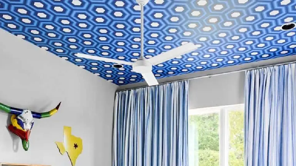 blue ceiling design with fan in a bedroom