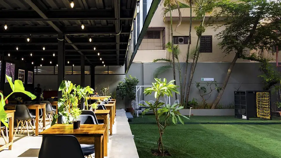 Black outdoor cafe seating arrangement in one of the best cafes in India