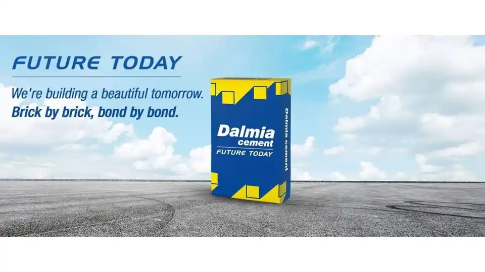 dalmia cement pack against blue sky and grey concrete