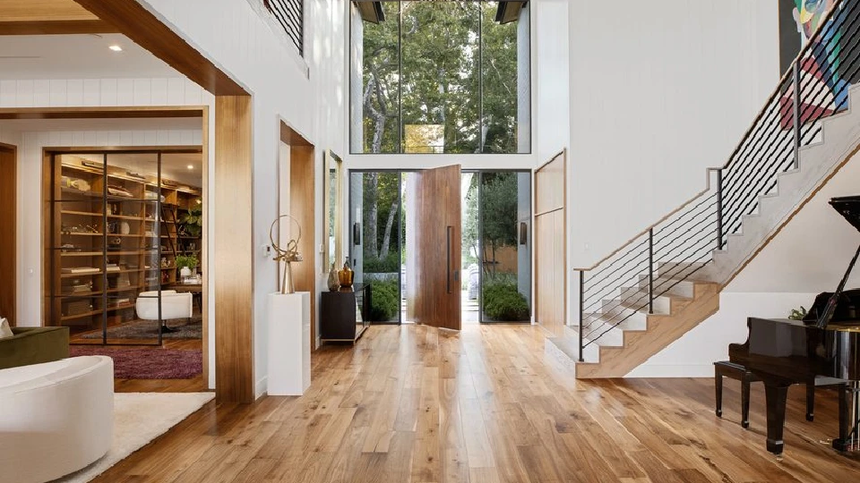 brown wooden door design with wooden floors, stairs in a hallway of a home