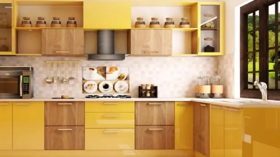 yellow and brown kitchen cabinets & cupboards in a kitchen with modern appliances