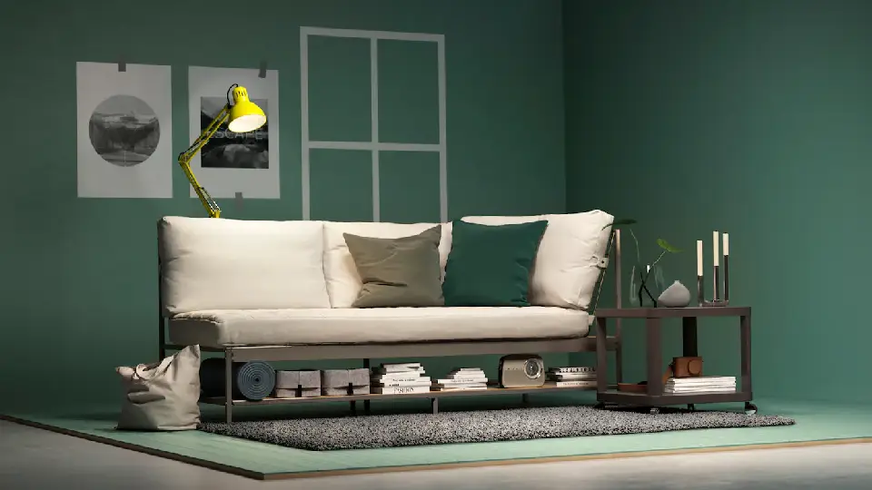 Ikea white leather sofa in living room with green painted walls in background