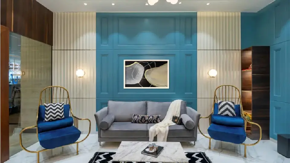 Blue room interior design with blue and gold couch - architecture firms in Pune