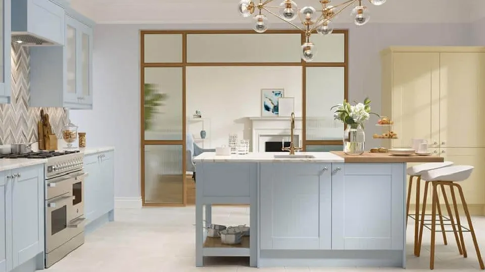 blue modular kitchen design with a chandelier, cabinets and appliances