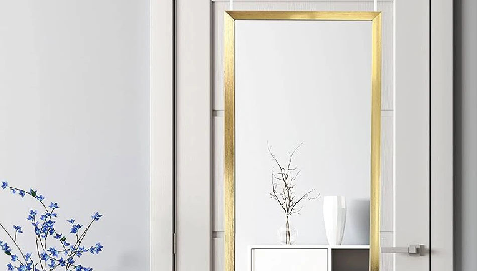 mirror on a white wooden door in a home