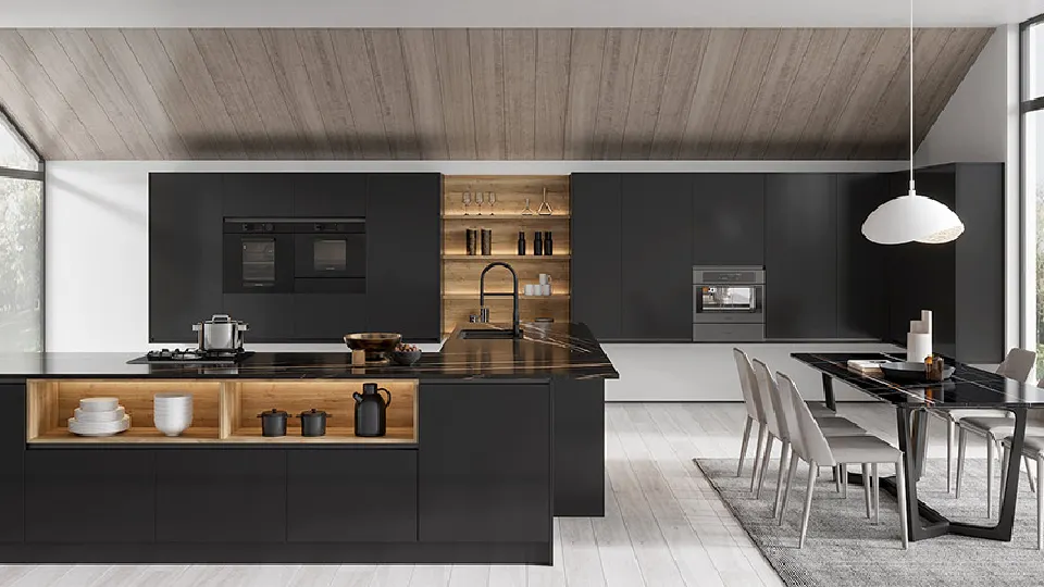 black cabinets with a table, chairs, pendant light, appliances