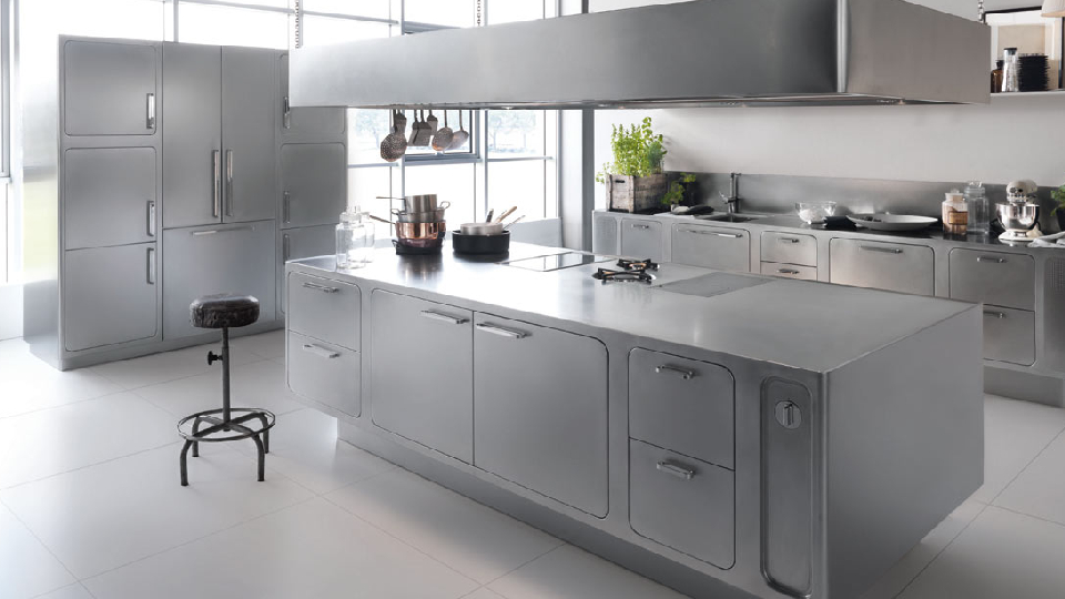 Stainless steel appliances, cabinetry, and accents in a cooking space 