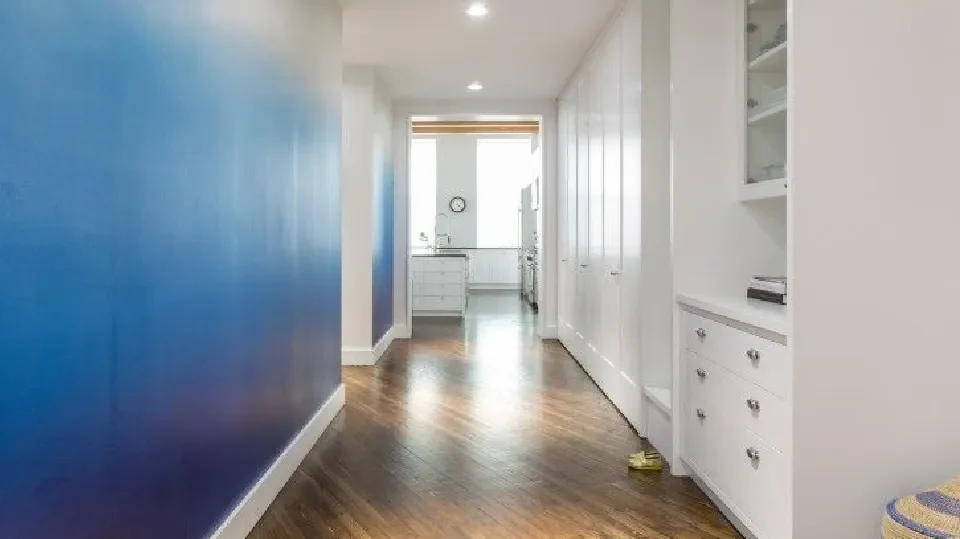 Ombre hallway in blue and white with cabinets