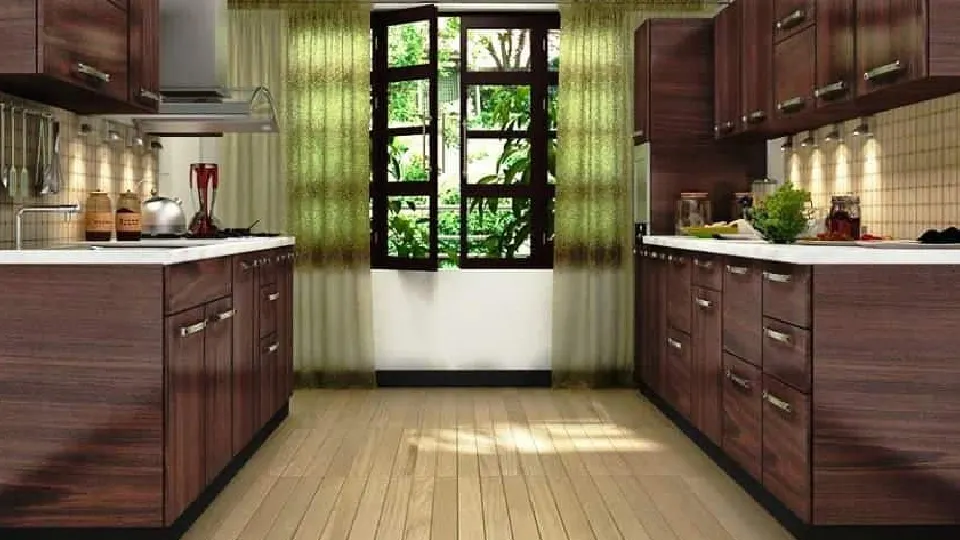 Two-row kitchen design interior having brown cabinets and green flowy curtains