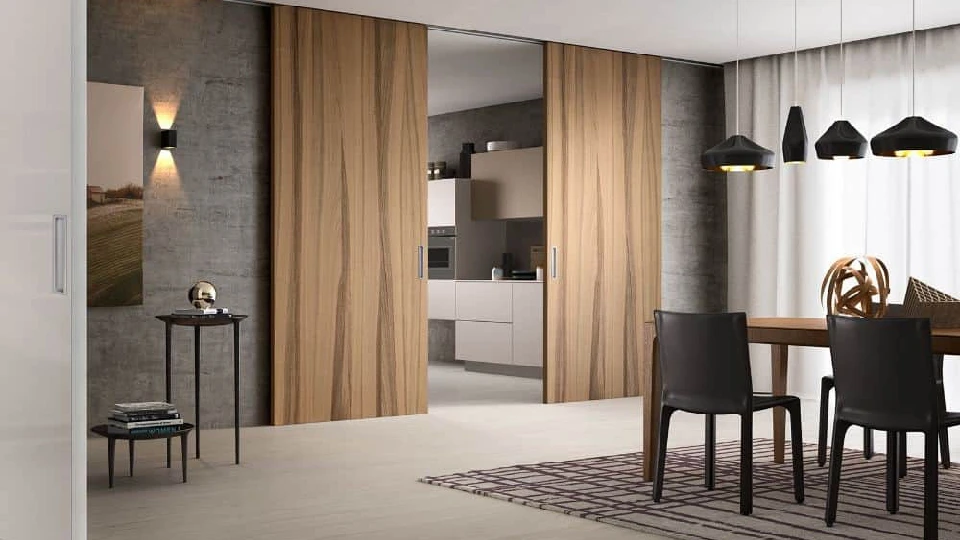 brown wooden gate in a living room with a table chair and rug