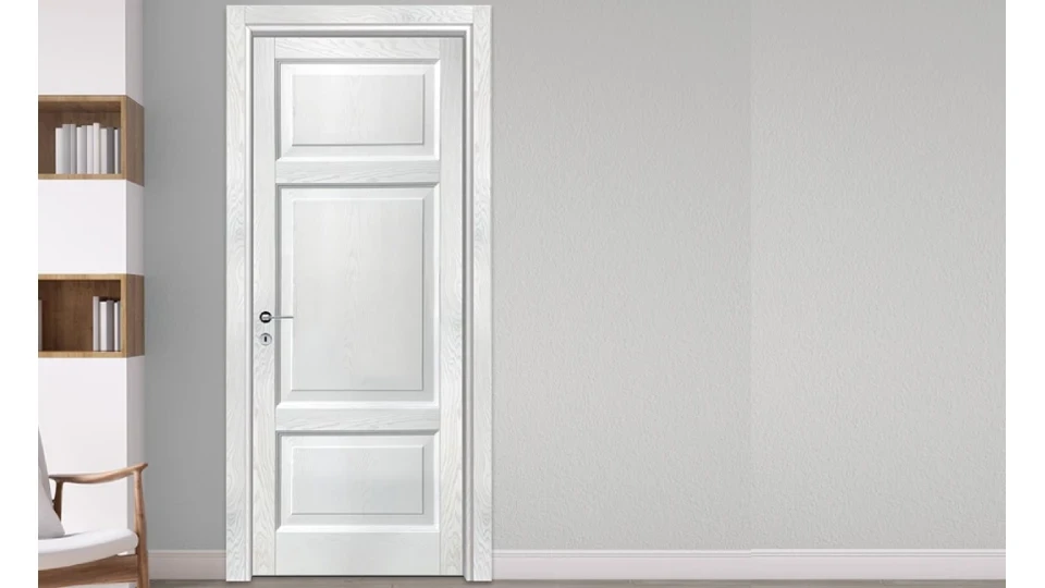 white wooden entryway in a living room with a brown chair and shelf