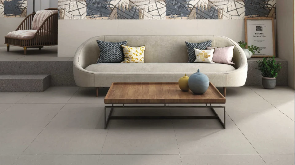 a minimalistic living room with flooring in grey finish